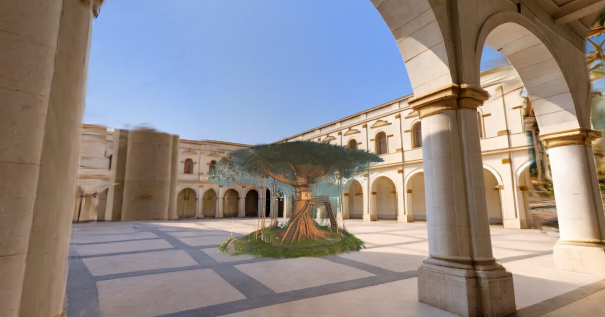 A great tree with a wooden stair around its trunk stands on a round lawn in a courtyard ringed by cream arcades with gold trim, under a clear blue sky.