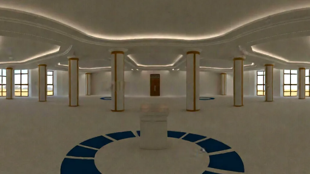 A bright white hall lined with columns and tall windows, with a small pedestal on a blue emblem at its centre.
